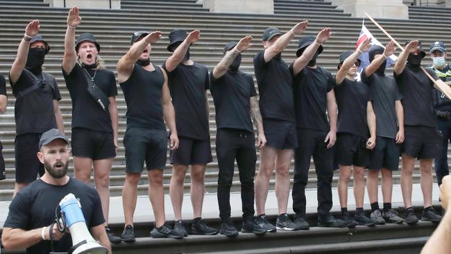 A far right wing group did the Nazi salute on the steps of Victoria’s Parliament. Picture: NCA NewsWire/David Crosling