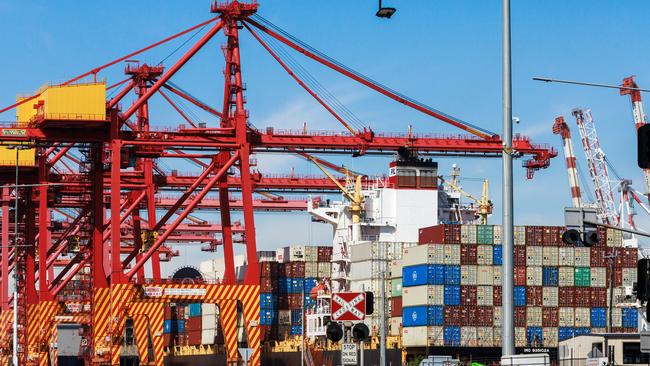 Shipping containers are loaded on to cargo ships at the Port of Melbourne. Picture: NewsWire / Aaron Francis