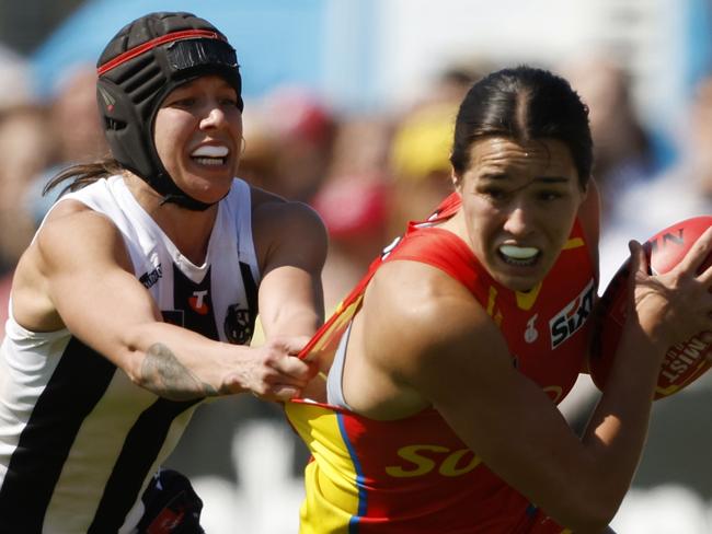 MELBOURNE, AUSTRALIA - SEPTEMBER 27: Brittany Bonnici of the Magpies tackles Lucy Single of the Suns during the round five AFLW match between Collingwood Magpies and Gold Coast Suns at Swinburne Centre, on September 27, 2024, in Melbourne, Australia. (Photo by Darrian Traynor/Getty Images)