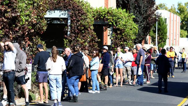 Long lines outside the Centrelink office in Norwood on Monday. Picture: AAP / Kelly Barnes