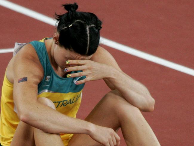 Aust athlete Jana Pittman sitting on track before 400m hurdle qualifying race at 2004 Athens Olympic Games 23 Aug 2004.