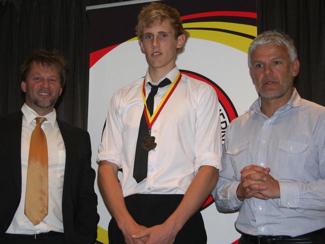 Nick Haynes with Stingrays region manager Mark Wheeler and coach Graeme Yeats in 2011.