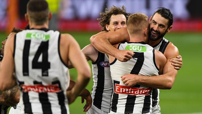 Brodie Grundy celebrates a memorable Magpies win with Adam Treloar. Picture: Getty Images