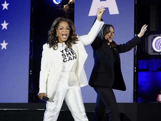 Oprah Winfrey, left, walks with Democratic presidential nominee Vice President Kamala Harris during a campaign rally outside the Philadelphia Museum of Art, Monday, Nov. 4, 2024, in Philadelphia. (AP Photo/Matt Rourke)