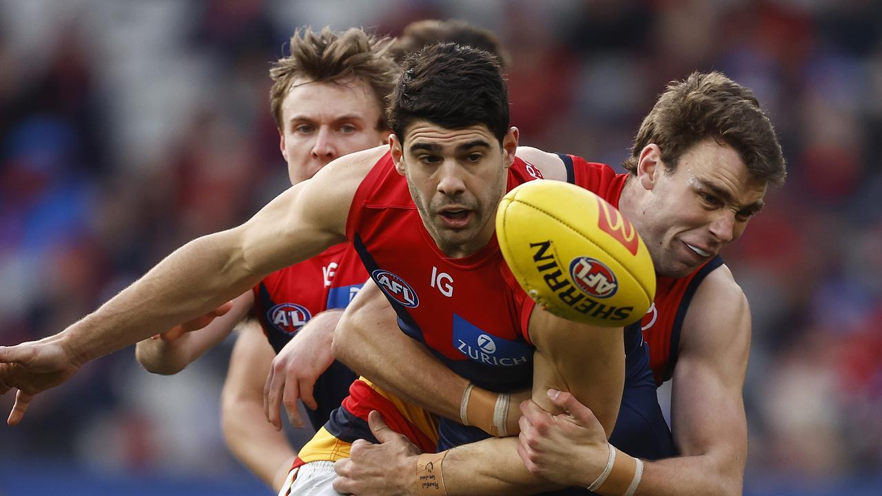 Christian Petracca is tackled by Riley Thilthorpe. Picture: Daniel Pockett/Getty Images