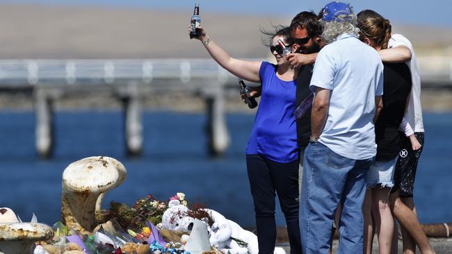 ALWAYS REMEMBERED: <span id="U603218114290d0H" style="letter-spacing:0.004em;">Family and friends of Damien Little raise a toast to the young father and the couple’s lost boys at the scene of the tragedy yesterday. </span>                        <b>Picture: DEAN MARTIN</b>