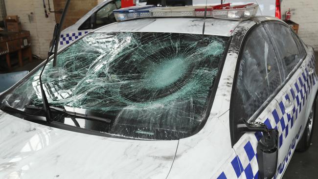 One of four police cars were damaged when police tried to break up a party in North Melbourne. Picture: David Crosling