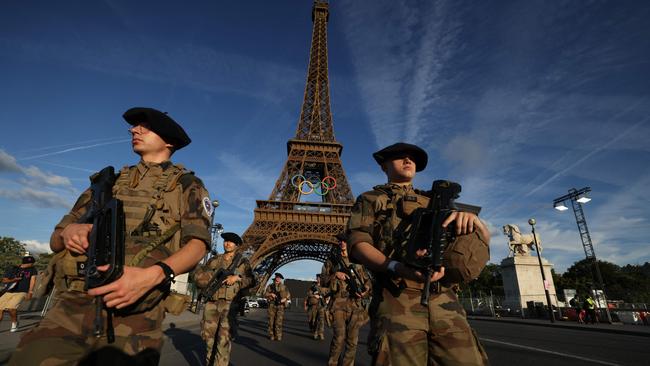 French soldiers patrol the Eiffel Tower precinct ahead of the olympic Games. Picture: AFP