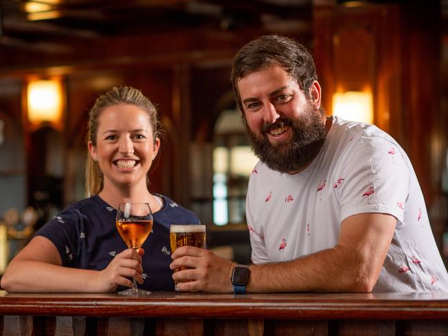 Hotel Darwin owners Penny Phillips and Brett Lubicz share a drink in celebration of their hotel reopening in Darwin. Hotel Darwin had to close completely when coronavirus restrictions came into place but have spent the time making their pub look as fresh as possible, ready for it to reopen. Picture: Che Chorley