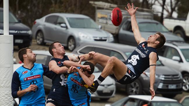 Panthers’ Joel Cross attempts to claim a sensational mark. Picture: Matt Loxton/AAP