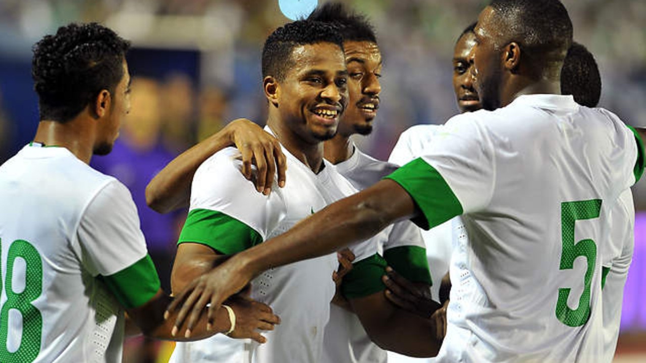 Saudi's players celebrate the second goal scored by Nasser al-Shamrani (C) against Iraq during their 2015 Asian Cup group C qualifying football match at Prince Mohammed bin Fahad Stadium in the Saudi city Dammam, on November 15, 2013. Saudi defeated Iraq 2-1.AFP PHOTO/STR (Photo credit should read STR/AFP/Getty Images)