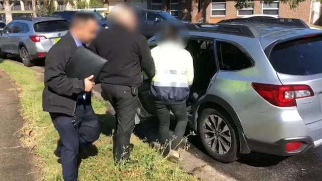 A man is arrested in Blacktown, NSW, as part of Operation Molto. Picture: AFP