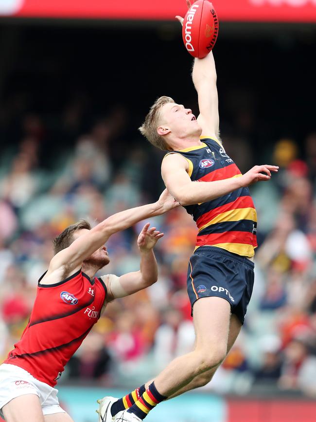 McAsey takes a one-handed mark in front of Essendon's Martin Gleeson last season. Picture: Sarah Reed