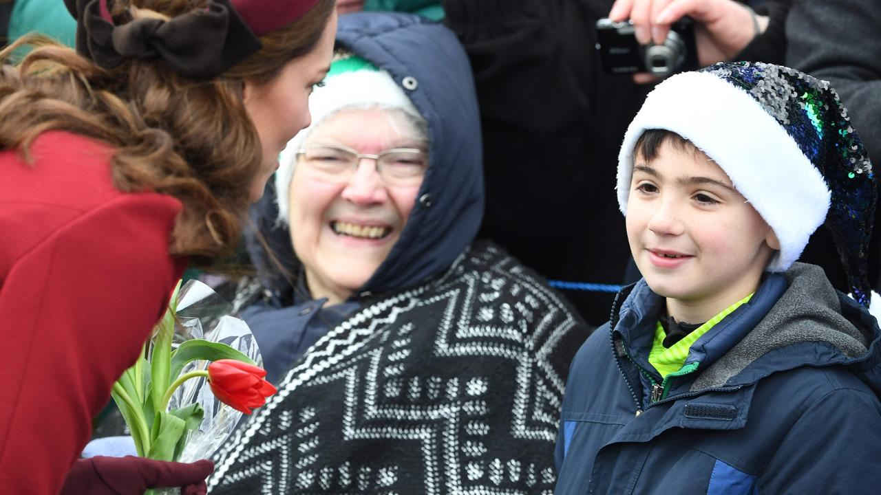 Kate meets Disco Santa. Picture: AFP 