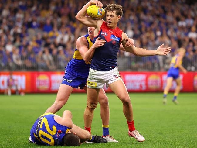 PERTH, AUSTRALIA - MAY 03: Jake Melksham of the Demons looks to the controlling umpire as Jeremy McGovern of the Eagles lays on ground following a collision with Harrison Petty of the Demons in a marking contest during the round eight AFL match between West Coast Eagles and Melbourne Demons at Optus Stadium, on May 03, 2025, in Perth, Australia. (Photo by Paul Kane/Getty Images)