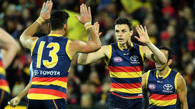 Jake Lever celebrates a goal with his captain Taylor Walker. Picture: Tom Huntley