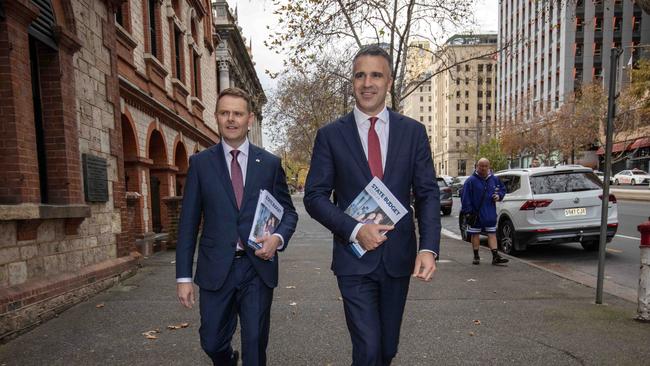 South Australian Premier Peter Malinauskas and Treasurer Stephen Mullighan with the budget papers outside SA Parliament House. Picture: NCA NewsWire / Emma Brasier.