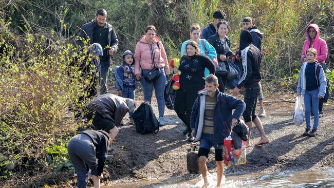 Canberra ‘condemns recent horrific violence in Syria’s coastal region’, as families of Syria's Alawite minority flee amid UN reports ‘many were summarily executed’. Picture: Fathi Al-Masri/AFP