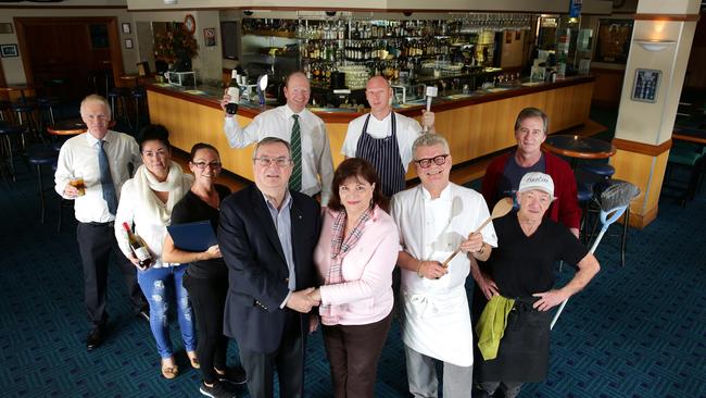 John Thorpe and Trish King with some of their long serving staff in 2015. Picture: Manly Daily