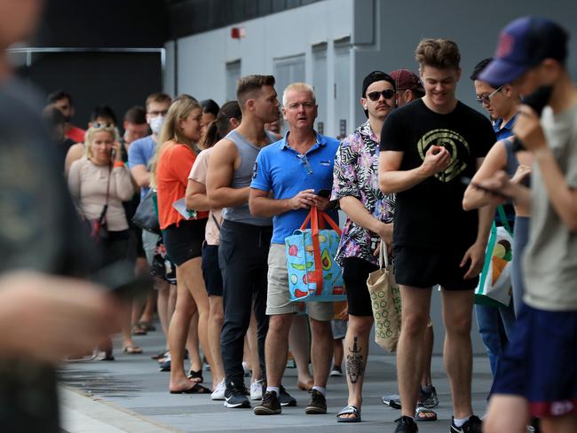 Hundreds of people line up to get into Woolworths at Gasworks Plaza in Newstead after it was announced Greater Brisbane will go into lockdown for 3 days from 6pm. Pics Adam Head