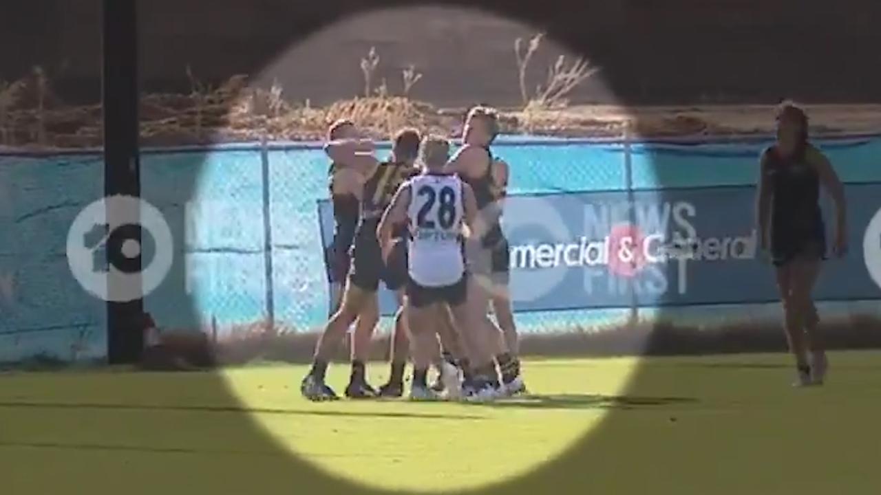 Adelaide teammates throw fists at training.