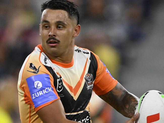 TOWNSVILLE, AUSTRALIA - MAY 24: Jayden Sullivan of the Tigers runs the ball during the round 12 NRL match between North Queensland Cowboys and Wests Tigers at Qld Country Bank Stadium, on May 24, 2024, in Townsville, Australia. (Photo by Ian Hitchcock/Getty Images)