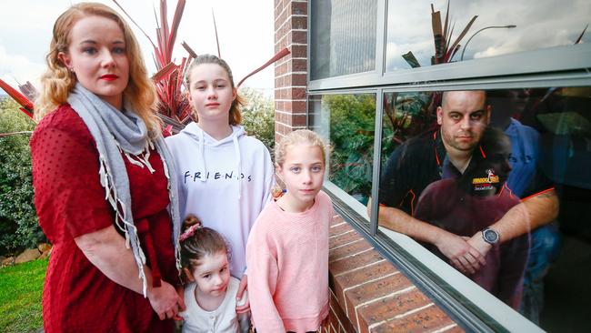 FIFO worker James in quarantine at his home in Launceston with his wife Jarrah and their children Harper, 11, Olivia, 9, and Quinn, 4, outside. Picture: PATRICK GEE