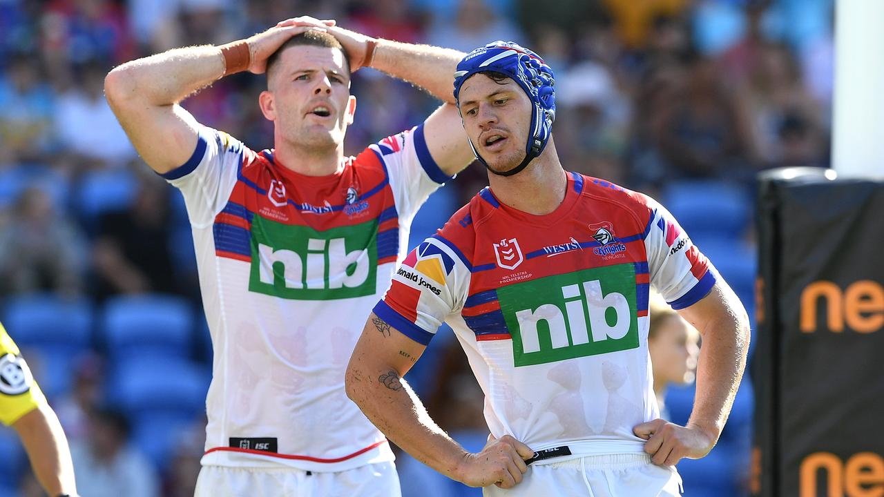 Lachlan Fitzgibbon (left) and Kayln Ponga of the Knights react following a Titans try during the Round 6 loss