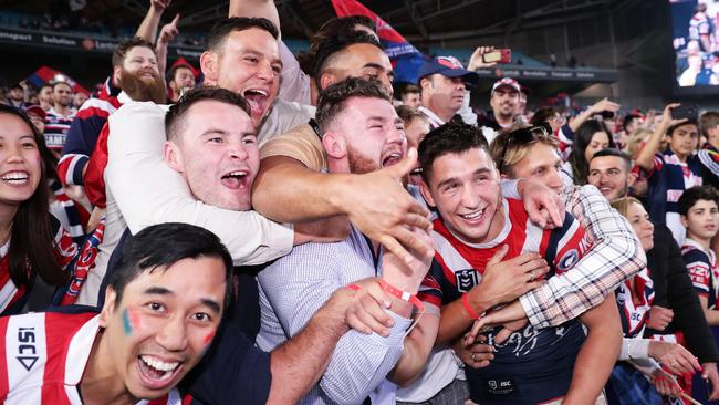 Pandemonium ... Roosters fans get a grip on player Victor Radley. Picture: Getty/Matt King