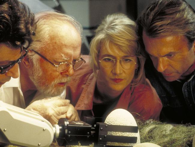 Jeff Goldblum as Dr. Ian Malcolm, Richard Attenborough as John Hammond, Laura Dern as Dr. Ellie Sattler and Sam Neill as Dr. Alan Grant, watching a robotic arm handle the dinosaur eggs in a scene from the film 'Jurassic Park', 1993.