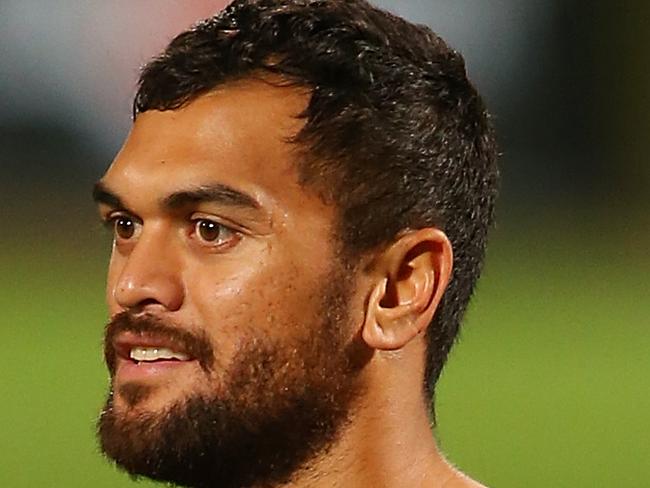 BRISBANE, AUSTRALIA - SEPTEMBER 18: (EXCLUSIVE COVERAGE) Karmichael Hunt holds the ball during a Queensland Reds training session at Ballymore Stadium on September 18, 2014 in Brisbane, Australia. (Photo by Chris Hyde/Getty Images)