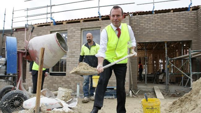 Opposition Leader Tony Abbott engages in hard labour at a Canberra building site. Picture: Kym Smith