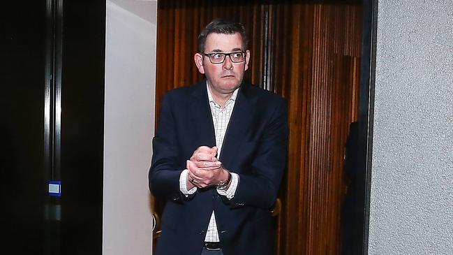 Victorian Premier Dan Andrews wipes his hands with sanitiser after announcing the lockdown of Metropolitan Melbourne and Mitchell Shire for 6 weeks due to a spike in the cases of the coronavirus. Picture: NewsWire/Ian Currie