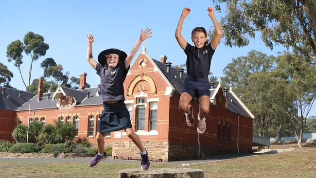 Natalie Egleton and her daughters Alice, 8 , and Essie, 10, at school for the $250k donation by News Corp to the rural and regional schools fund to help children in bushfire affected communities. .Picture: Alex Coppel.