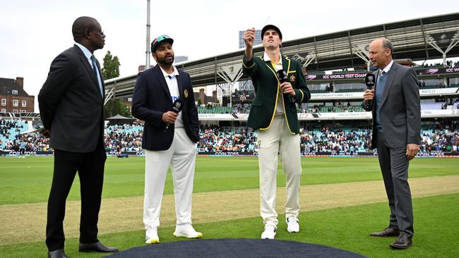 Pat Cummins tosses the coin as Rohit Sharma calls correctly on the opening day of the World Test Championship final at The Oval in London Picture: Getty Images