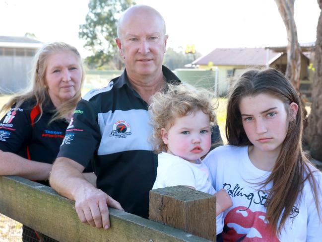 L-R Margaret, Denis 13 year old Rebecca and 2 year old Quinn Uildriks pose for photographs in Riverstone. Riverstone, Friday, September 14th 2018. 11 homeowners in Riverstone are furious following the release of the West Schofields Masterplan, which will see the acquisition of their homes over the next 20 years for sporting fields. (AAP Image / Angelo Velardo)