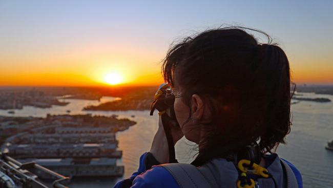 Capturing sunset from the Sydney Harbour Bridge. Picture: John Borthwick