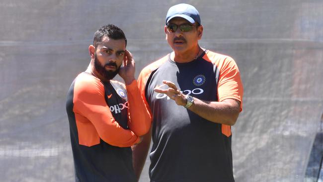 India captain Virat Kohli (left) and coach Ravi Shastri (right) look on during the team training session at the Adelaide Oval in Adelaide, Wednesday, December 5, 2018. Australia play India in the first Test match Thursday. (AAP Image/Dave Hunt) NO ARCHIVING