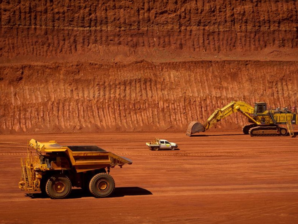 FILE PHOTO: Machinery operates in a pit at Rio Tinto Group's West Angelas iron ore mine in Pilbara, Australia, on Sunday, Feb. 19, 2012. Rio Tinto Group said Chief Executive Officer Tom Albanese will step down, after announcing a surprise $14 billion impairment. Sam Walsh, head of the iron-ore division, has been appointed as his successor with effect from today, the company said in a statement. Photographer: Ian Waldie/Bloomberg via Getty Images