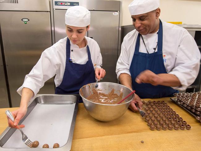 Kitchen staff work in the Royal Kitchen at Windsor Castle in Windsor on May 10, 2018 as they begin preparations for the wedding banquet. Picture: AFP