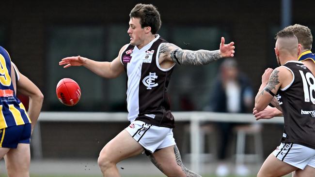 EDFL: Craigieburn’s Corey Middleton gets a kick. Picture: Andy Brownbill