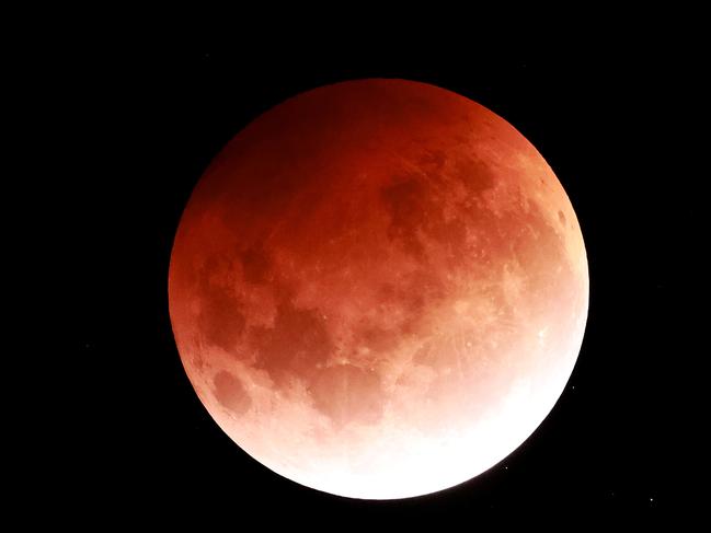 AUCKLAND, NEW ZEALAND - MAY 26: The Total Lunar Eclipse of the Moon is seen on May 26, 2021 in Auckland, New Zealand. It is the first total lunar eclipse in more than two years, which coincides with a supermoon.  A super moon is a name given to a full (or new) moon that occurs when the moon is in perigee - or closest to the earth - and it is the moon's proximity to earth that results in its brighter and bigger appearance. (Photo by Phil Walter/Getty Images)