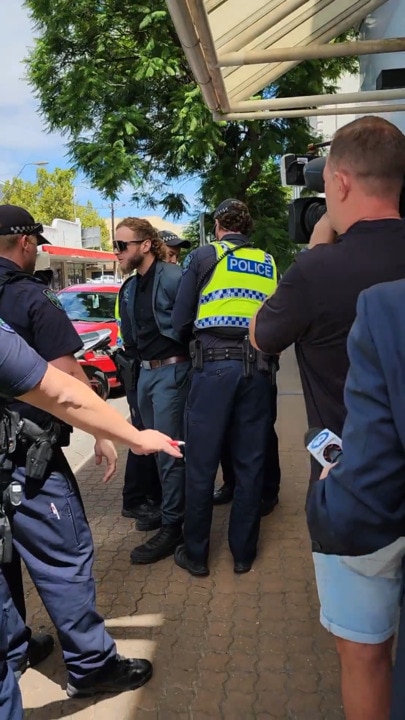 Joel Davis arrested for displaying a Nazi symbol outside Adelaide Watch House