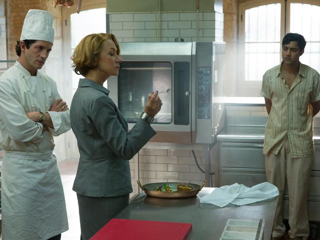 Hassan Kadam (Manish Dayal, right) endures Madame Mallory's (Helen Mirren) scrutiny of his culinary work, as chef Jean Pierre (Clement Sibony) looks on, in a scene from film The Hundred-Foot Journey.