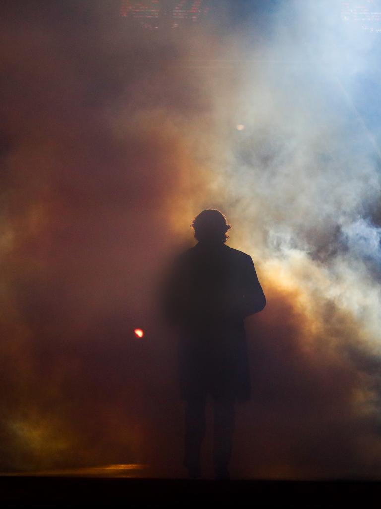 James Hird emerges from a puff of smoke at the MCG. Picture: AFL Photos/Getty Images