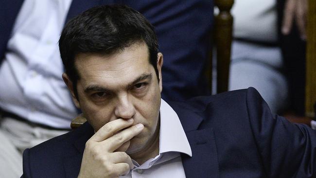 FILES - A picture taken on June 27, 2015 shows Greek Prime Minister Alexis Tsipras attending a parliamentary session in Athens. Tsipras announced his resignation and called for early elections in the crisis-hit country on August 20, 2015. AFP PHOTO / ANGELOS TZORTZINIS