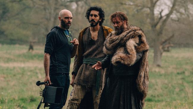 Director David Lowery on set with Dev Patel and Joel Edgerton in Ireland. Picture: Eric Zachanowich/A24