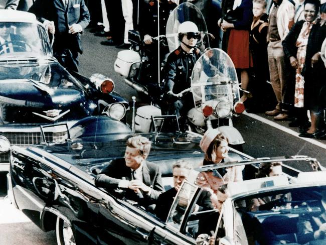 President John F Kennedy in the presidential limousine before his assassination. Picture: Getty Images