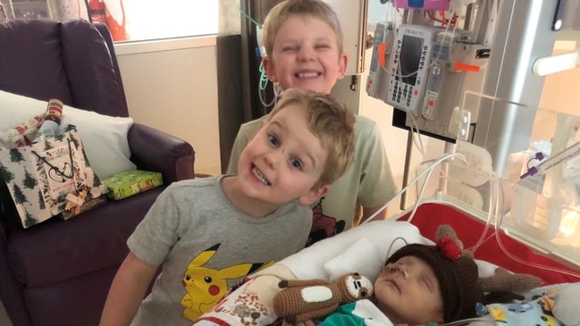 Vann has come a long way from the six weeks he spent in the neonatal intensive care unit last Christmas. He is pictured alongside his brothers Oscar and Levy.