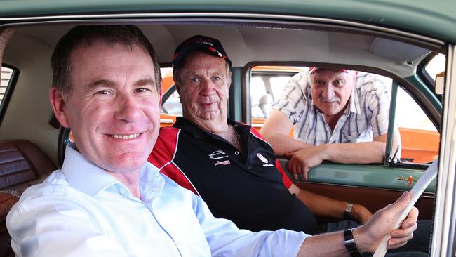 Wakefield MP Nick Champion at the wheel of a 1964 Holden EH Premier in February with Peter Field of Craigmore and Robert Leggio of Parafield Gardens. Picture: Stephen Laffer